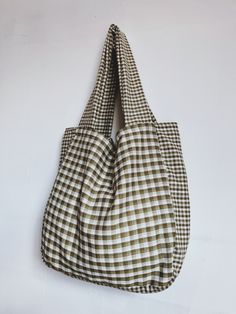 The Walker Home Gingham overnight/ shopper bag. Our design uses two contrasting ginghma checks to create a unique look - linked with washed cotton inside. 100% cotton Measures 21 inch width x 22 inches height Hand made in the U.K. Wash at 30 degrees Cotton Tote Shoulder Bag For Picnic, Casual Gingham Shoulder Bag For Picnic, Cotton Gingham Bags For Everyday Use, Gingham Cotton Bags For Everyday Use, Rectangular Plaid Shoulder Bag For Picnic, Casual Plaid Bag For Picnic, Gingham Tote Bag For Picnic, Casual Gingham Tote Bag, Everyday Gingham Tote Bag