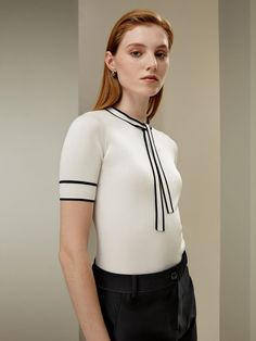 Crafted from premium mulberry silk, this white knit top features black-trimmed cuffs and hem for a modern touch. Soft, breathable, and perfect for work or everyday wear. Available in various sizes. White Knit Top, Silk Knit, Black Trim, Mulberry Silk, Black Stripes, Breathable Fabric, Knit Top, Steam, Top Brands