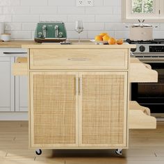 a kitchen cart with some oranges on it