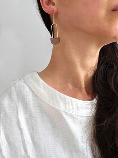 "| Long Loop Earrings | These semicircle geometric earrings are made with translucent acrylic and are perfect for everyday wear. They are lightweight and comfortable and would look great with various outfits. + Color: brown or white + Material: gold-filled, acrylic + Size: appx. 2.5\"h x .6\"w                   -------------- Made to order in the USA, please allow up to 1-2 weeks to ship. Please note that all jewelry is made to order and may vary slightly from the photograph. All jewelry is packaged in a gift box for giving or keeping. Don't forget to take a look at my shop policies before ordering for important information regarding turnaround times, shipping methods and returns." Modern Brown Earrings With Ear Wire, Chic Brown Earrings For Everyday Wear, Chic Everyday Brown Earrings, Chic Brown Everyday Earrings, Modern Tarnish-resistant Long Drop Jewelry, Minimalist Long Drop Brass Jewelry, Modern Brown Drop Earrings, Modern Gold-tone Linear Drop Earrings, Minimalist Brass Linear Earrings With Long Drop