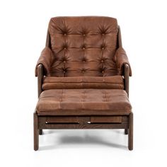 a brown leather chair and footstool sitting next to each other