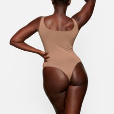 A flattering wardrobe staple with a second-skin feel, wide double scoop neckline, and thin shoulder straps. This bodysuit is made to wear alone or under... Tan People, Basic Bodysuit, Scoop Neck Bodysuit, Square Neck Bodysuit, White Bodysuit, Size 16 Dresses, Tigers Eye, Base Layer, Second Skin