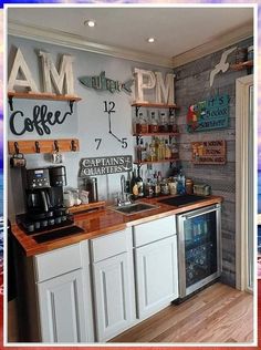 a kitchen with white cabinets and wooden counter tops next to a wall mounted clock that reads i am coffee