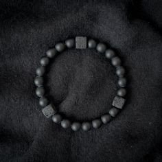 A grounding stone, Onyx is believed to absorb negative energies, alleviates worries and tensions, and eliminates confusion. It helps in being structured and letting go of unhappy thoughts. There is 1 accent cube Lava Stone bead, which is repeated 3 times for Balance. A grounding stone, Lava Stone is believed to provide stability during times of change and encourages strength and courage. It promotes change where needed for behavioral issues and enhances fertility. This bracelet has an elastic ba Balance Bracelet, Womens Bracelet, Bracelet Mens, Bracelet Gemstone, Healing Bracelets, Lava Stone, Gemstone Bracelet, Stretch Bracelet, Fertility