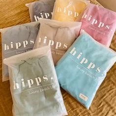 five bags of hips laundry sitting on top of a bed