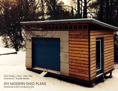 a small wooden shed sitting on top of snow covered ground