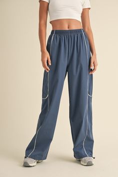 Get ready to up your style game with our Sporty Track Pants! Made with durable nylon and accented with contrast piping, these pants are both stylish and practical. Plus, the adjustable drawstring ankles ensure the perfect fit. Perfect for a sporty and fashionable look. Contrast Piping, New Tops, Sale House, Get Ready, Track Pants, Denim Dress, Piping, Your Style, Active Wear