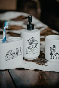 three bathroom accessories including toothbrush and soap dispenser on a wooden table