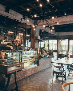 the inside of a restaurant with tables and chairs