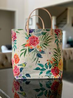 a floral bag sitting on top of a table