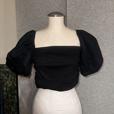 Elevate Your Wardrobe With This Stunning Zara Women's Crop Top Shirt In Solid Black. The Top Features A Square Neckline And Short Balloon Sleeves, Adding A Playful Touch To The Overall Look. Made From 100% Cotton With Stretch, This Blouse Is Both Comfortable And Stylish. The Ribbed Texture And Cropped Style Make It Perfect For Pairing With High-Waisted Bottoms, While The Size L Ensures A Great Fit For Women Of Many Sizes. This Blouse Is Brand New With Tags, Making It A Great Addition To Any Ward Trendy Puff Sleeve Tops For Night Out, Fitted Cotton Crop Top With Puff Sleeves, Stretch Cotton Blouse For Night Out, Stretch Padded Blouse For Night Out, Fitted Puff Sleeve Top For Summer Workwear, Casual Fitted Puff Sleeve Top For Party, Trendy Cotton Blouse For Night Out, Elegant Cotton Top For Night Out, Fitted Puff Sleeve Tops For Date Night