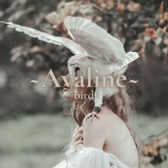 a woman with an owl on her shoulder and the words avaline bird above her head