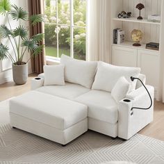 a living room with a large white sectional couch