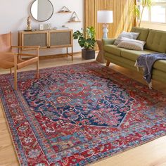 a living room filled with furniture and a rug