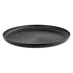 an empty black plate on a white background