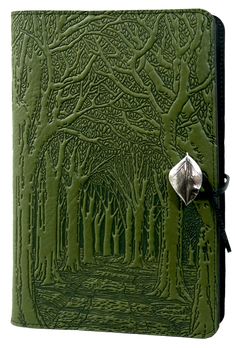 a green leather journal with trees on it