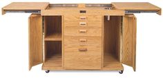 a wooden cabinet with drawers on wheels and two doors open to reveal the bottom shelf