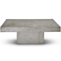 a concrete table sitting on top of a white floor