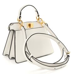 This is an authentic FENDI Shiny Nappa Petite Peekaboo I SEE U Satchel in White. This chic tote is finely crafted of white soft calfskin leather. This petite sized bag features a top leather handle, adjustable leather shoulder strap with gold hardware. This bag also features gold squared turn locks on either side that when released, opens to the inner panel of leather with a hanging patch pocket. Pokemon Fabric, Fendi Peekaboo Bag, Fendi Peekaboo, Python Print, Pony Hair, Shopper Tote, Fendi Bags, Pink Brown, Leather Handle