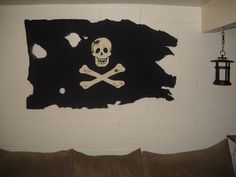 a skull and crossbones on a pirate flag painted on a wall in a living room