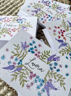 four cards with floral designs on them and the words, always written in cursive writing