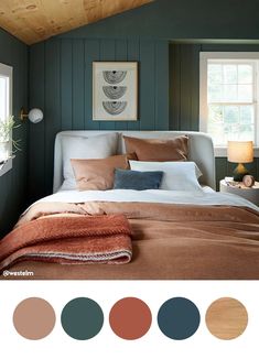 a bedroom with green walls and brown bedding in the center is an orange throw pillow