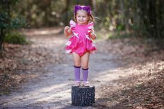 Cheshire Cat Inspired Romper Sweet baby and toddler romper was inspired by the Cheshire Cat.  Done in hot and light pink shades.  Flutter sleeves tie in a bow in back. Elastic at the back for a perfect fit.  Snap Closure Playful Pink Bubble Romper For Cake Smash, Cute Pink Bubble Romper For Cake Smash, Playful Pink Bubble Romper For Party, Cute Pink Bubble Romper For First Birthday, Cute Pink Bubble Romper For Birthday, Playful Fitted Bubble Romper For Birthday, Playful Fitted Bubble Romper For First Birthday, Pink Ruffles Bubble Romper For Cake Smash, Cute Pink Onesie For Party