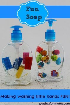 two soap dispensers sitting on top of a counter next to each other