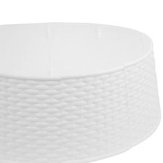 a large white bowl sitting on top of a table