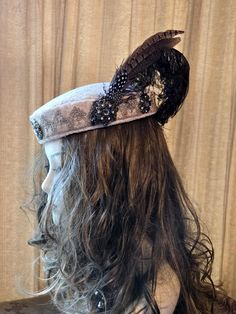 This hat will go with about every noble garb. The base is a vintage hat form, covered with rich leaf pattern fabric. Dainty gold trim around the edge as well as antique looking bronze medallions.  Topped off with a small spray of feathers including a vintage curled plume. Beautiful! Ivory Hat, Hat Form, Vintage Curls, Vintage Hat, Costume Hats, Pattern Fabric, Hats Vintage, Leaf Pattern, Gold Trim