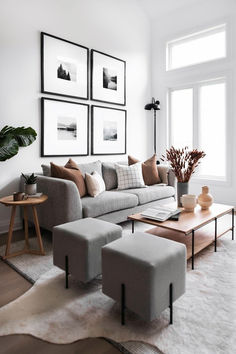 a living room filled with lots of furniture and pictures on the wall above it's coffee table