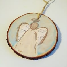 a wooden ornament with an angel on it