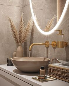 a bathroom sink sitting under a round mirror