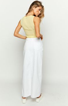 * White Denim Maxi Skirt 
 * 
 
 * HOW TO STYLE: 
 * Everyone needs a white denim () skirt in their wardrobe! We're in love with the uneven waist and center split on this maxi skirt (). This basic () can be worn in any season, pairing perfectly with bright crop tops and cozy knits.  
 * 
 
 * FEATURES: 
 * Maxi length  
 * High waist 
 * Mid weight denim material 
 * Zip and button closure 
 * Belt loops 
 * Little to no stretch 
 * Front and back pockets White Denim Maxi Skirt, Prom Midi Dress, White Denim Skirt, Summer Playsuit, Denim Maxi, Beginning Boutique, Denim Maxi Skirt, Denim Material, Strapless Tops