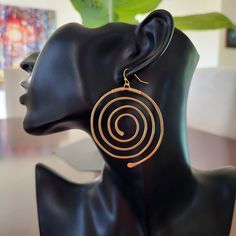 Large Gold Spiral Circle Earrings --handmade & unique --made of solid brass --high quality --comfortable to wear --tribal ethnic inspired design  --easy to wear style will go with many different outfits -- brass ear hooks - nickel free, lead free and cadmium free Size: Approx. 2.75 inches long (measurement includes the ear hooks) 2 inches wide Same earrings in SILVER here: https://www.etsy.com/ca/listing/1759541075 Spiral Earrings, Circle Earrings, Earrings Handmade, Gold Earrings, Favorite Jewelry, Jewelry Earrings Dangle, Dangle Drop Earrings, Dangle Earrings, Handmade Jewelry