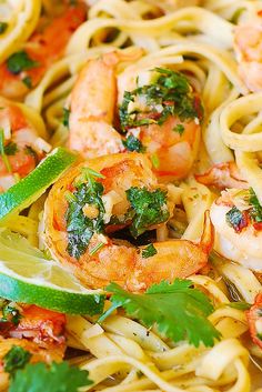 pasta with shrimp, parsley and lime garnish