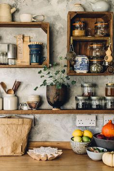 the shelves are filled with many different types of spices and other kitchen items on them