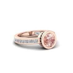 a pink diamond engagement ring with channel set diamonds