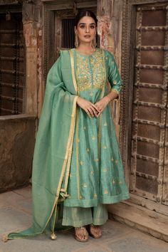 Turquoise green A-line kurta in linen silk base fabric embroidered in gota work. Paired with tissue palazzo and tissue organza dupatta.
Component: 3
Pattern: Embroidered
Type Of Work: Gota Work
Neckline: Round
Sleeve Type: Straight
Fabric: Kurta: Linen Silk; Palazzo: Tissue; Dupatta: Tissue Organza; Lining: Mulmul, Shantoon
Color: Green
Other Details: 
Contrast gold gota embroidery
Tassel dupatta
Occasion: Mehendi and Haldi - Aza Fashions Tissue Dupatta, Kurta Skirt, Chanderi Dupatta, Red Kurta, Pink Kurta, Kurta Set For Women, Gota Work, A Line Kurta, Embroidered Border