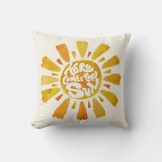 a yellow and orange pillow with the words, we are one in sun on it