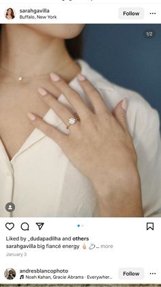 a woman's hand with a diamond ring on top of her left hand and an instagram page below