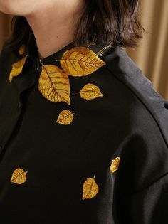 Step into elegance with our Golden Leaf Embroidered Blouse. This exquisite blouse features shimmering golden leaf embroidery that catches the light beautifully, evoking the radiant glow of sunlight. Imagine the joy and confidence you'll feel wearing this piece. Versatile and stylish, it pairs perfectly with jeans, shorts, skirts, and more, making it a must-have addition to your wardrobe. Materials:High-quality polyester for a soft and comfortable fit Design Features:Intricate golden leaf embroid Short Tank Top, Golden Leaf, Mens Cardigan Sweater, Cami Shirt, Gold Blouse, Golden Leaves, Gold Thread, Embroidery Blouse, Color Dorado