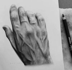 a pencil drawing of a hand on top of a piece of paper