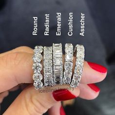 a woman's hand is holding three rings with diamonds on each ring and the words,