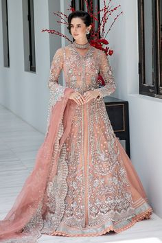 Luxury Pakistani Wedding Wear Embroidered Peach Pink Pishwas Frock emerges as a vision of ethereal beauty. Its tulle canvas is adorned with glistening tilla embroidery and intricate threads placed beautifully in shades of peachs, ivory and periwinkle, adorned with pearls and sequin accents, accented by delightful pops of silver. Paired harmoniously with silk skirt finsihed with sequenced border and laces. Embroidered Gown Frock: This is a stunning organza dupatta is decorated with heavily embroi Islamic Modesty, Tilla Embroidery, Frock Models, Lehenga Gown, Couture Bridal, Peach Wedding, Organza Dupatta, Pakistani Wedding, Ethereal Beauty