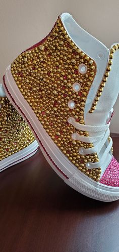 All sneakers are HANDMADE & designed with SWAROVSKI crystals and pearls. Great for birthdays, social events, weddings, proms, school events or just to get your shine on. PLEASE NOTE BOTH SIDES OF THESE SNEAKERS ARE FULLY BLINGED (BEDAZZLED Converse runs a half size larger; I highly recommend getting sized before placing an order. Due to the nature of PERSONALIZED products, I DO NOT offer REFUNDS, RETURNS, OR EXCHANGES unless it is my mistake on the design process. CURRENT TURNAROUND IS 7 TO 10 D Blinged Shoes, Bedazzled Converse, Sparkly Converse, Rhinestone Converse, Shoe Custom, Customised Clothes, Women Converse, Glitter Converse, Bedazzled Shoes