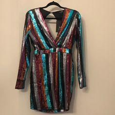 Gorgeous Mini Dress , This Is A Large But Does Run On The Smaller Size . It Is Lined And Very Soft ! Never Worn , Tags On Still On It . Multicolor Bodycon Party Dress, Multicolor Long Sleeve Bodycon Party Dress, Long Sleeve Multicolor Bodycon Party Dress, Multicolor Long Sleeve Dress For Night Out, Multicolor Long Sleeve Bodycon Dress For Night Out, Multicolor Mini Bodycon Dress For Party, Glamorous Multicolor Long Sleeve Mini Dress, Glamorous Long Sleeve Multicolor Mini Dress, Multicolor Long Sleeve Mini Dress For Party Season