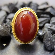 ARTSMYRNA METAL: 925k Silver GEM: Carnelian ( lab created ) Diameter Stone Size: 14x10 mm COATING: 24k gold over (We can made a special type of coating for your personal preference ) MATERIEL : 925K Sterling Silver ( Some of my items vermeil gold over silver for looks rich . But i can finish in silver too ) RING SIZE: 6 (your desired size is made) SPECIAL ORDER IS MADE. If you send us a photo of your desired model (you can send your gem.) We can do it for you. We can make any design you want wit Oval Agate Ruby Ring For Anniversary, Amber Carnelian Ring With Cabochon, Antique Carnelian Ring As A Gift, Classic Carnelian Cabochon Rings, Antique Carnelian Ring As Gift, Antique Carnelian Rings For Gifts, Antique Carnelian Ring For Gift, Handmade Carnelian Amber Rings, Handmade Amber Carnelian Rings