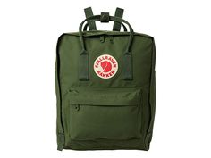 Fjallraven Kanken - Backpack Bags : Spruce Green : Getting its start in 1978 among Swedish school children, the Fjällräven Kånken backpack has grown from a schoolyard staple to a fashion icon. The lightweight Kånken daypack is built on rugged Vinylon fabric, includes a comfortable foam back panel that doubles as a seat cushion, and has a simple-but-effective carry system that can be used as a tote or worn on the shoulders. Large main compartment to hold all your daily essentials. Front zip pocke Rectangular Casual Backpack For Hiking, Casual School Backpack With Logo Patch, Casual Everyday Backpack With Logo Patch, Casual Durable Backpack For Back To School, Casual Green Backpack For Hiking, Fjällräven Kånken, School Yard, School Children, Fashion Icon