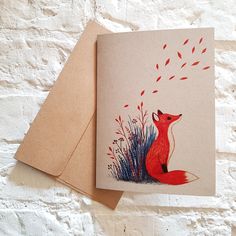 a card with an image of a red fox on it's front and back